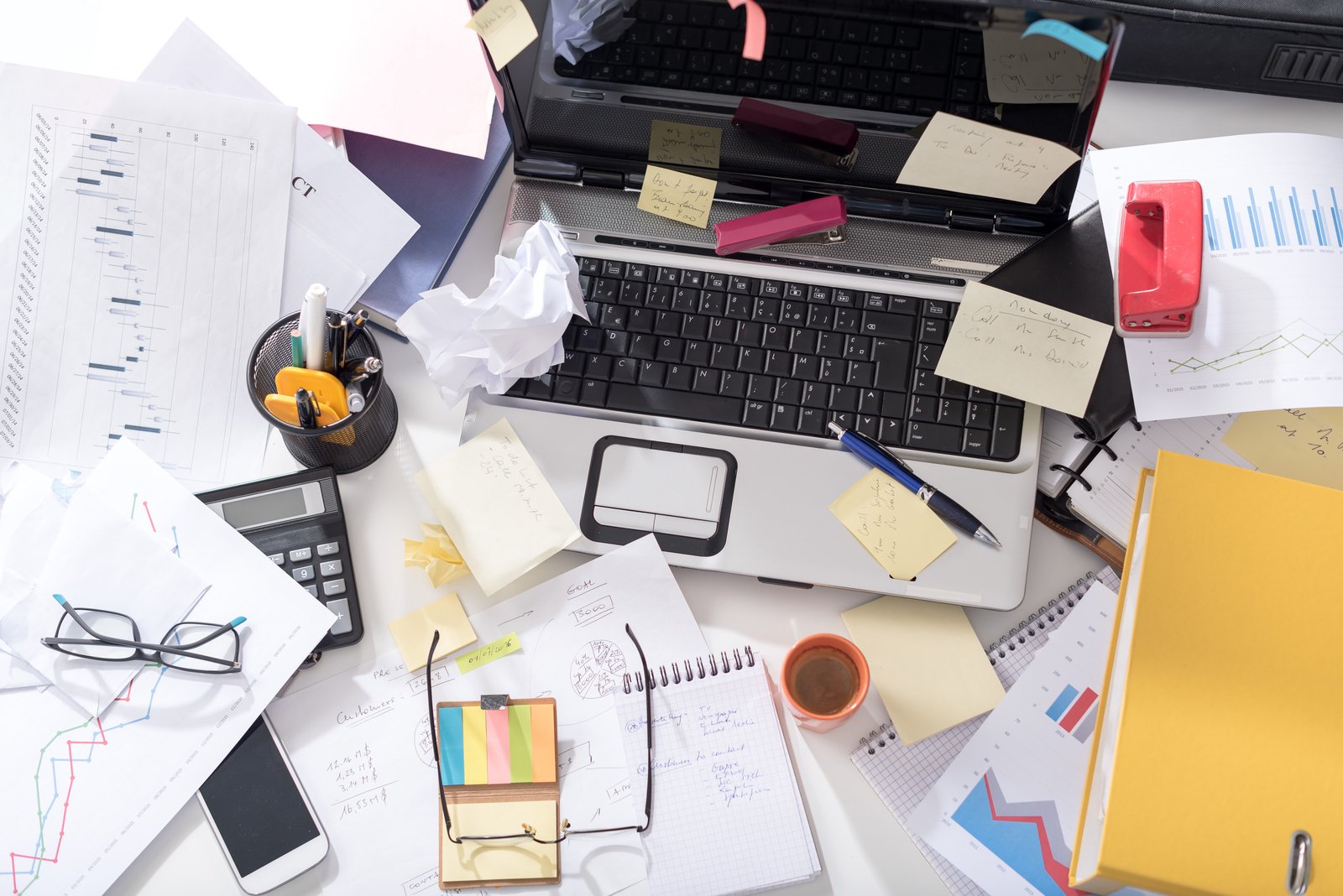 stuck in a rut - how to get unstuck - Messy and cluttered office desk